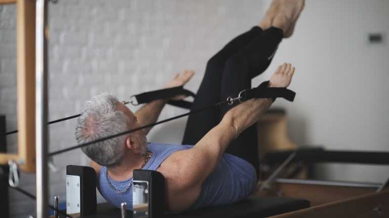 A man doing pilates at Fit Club Amersham