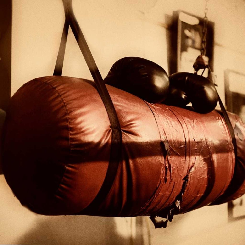 A big boxing bag along with boxing gloves at gym in Amersham