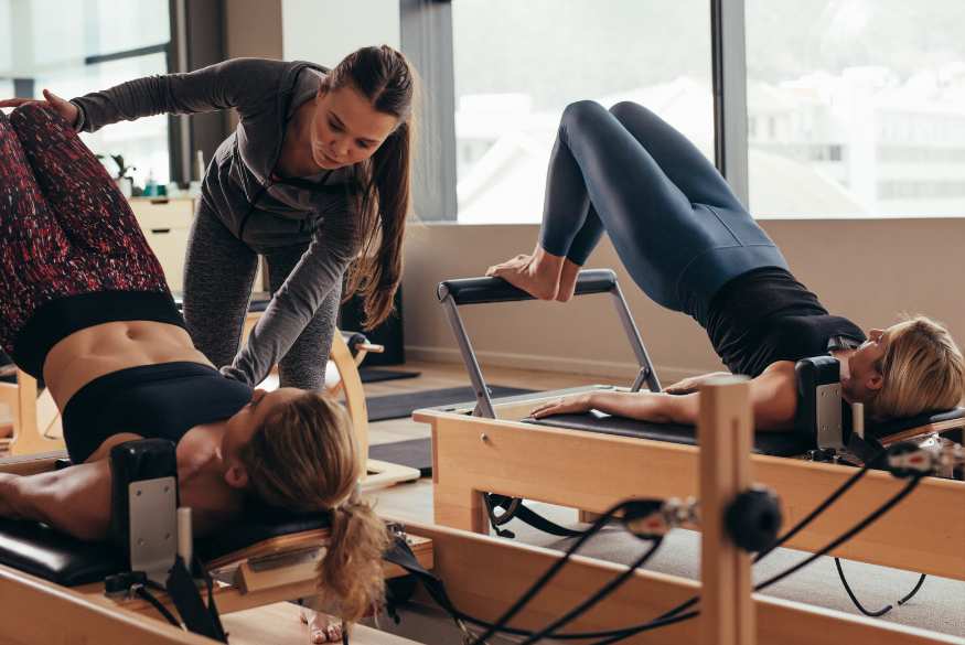 A woman improving her posture by doing pilates in amersham